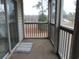 Private screened porch with view of trees and neighborhood at 1230 St. George Ln. # B, Myrtle Beach, SC 29588