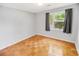 Simple bedroom with wood floors and window at 660 Cardinal Ave. # 660, Myrtle Beach, SC 29577