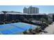 Stunning aerial view showcasing tennis courts and a community pool area at 212 2Nd Ave. N # 362, North Myrtle Beach, SC 29582