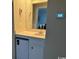 Bathroom wet bar area includes a mini fridge and mirror at 212 2Nd Ave. N # 362, North Myrtle Beach, SC 29582