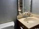 Bathroom vanity with shell decorations around the mirror at 212 2Nd Ave. N # 362, North Myrtle Beach, SC 29582