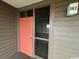 Condo entrance with coral door, security screen, and visible unit number at 212 2Nd Ave. N # 362, North Myrtle Beach, SC 29582