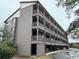 Exterior view of condo building with multi-level balconies, covered parking, and well kept landscape at 212 2Nd Ave. N # 362, North Myrtle Beach, SC 29582