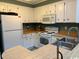 Bright kitchen featuring modern appliances, plenty of counter space, and a convenient breakfast bar at 212 2Nd Ave. N # 362, North Myrtle Beach, SC 29582
