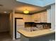 Well-equipped kitchen featuring white appliances, ample counter space, and updated cabinets at 212 2Nd Ave. N # 362, North Myrtle Beach, SC 29582