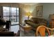 Comfortable living room with sliding door to the balcony and view of the community at 212 2Nd Ave. N # 362, North Myrtle Beach, SC 29582