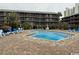 Inviting community pool area with lounge chairs, perfect for relaxation and recreation at 212 2Nd Ave. N # 362, North Myrtle Beach, SC 29582