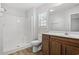 Clean bathroom with a shower, toilet and wood vanity at 734 Woodside Dr., Conway, SC 29526