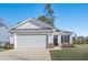 Craftsman style home with white siding, brick accents, and a two-car garage at 734 Woodside Dr., Conway, SC 29526