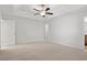 Spacious main bedroom with carpet and ceiling fan at 734 Woodside Dr., Conway, SC 29526