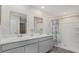 Bathroom with double sinks and vanity and walk-in shower with shower curtain at 182 Cambridge Dr., Tabor City, NC 28463