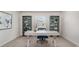 Office space with a white desk, blue chair, teal shelves, and natural light at 182 Cambridge Dr., Tabor City, NC 28463