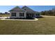 Charming one-story home with manicured lawn and inviting front porch at Tbd 16 Privetts Rd., Conway, SC 29526