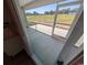 View from inside looking out onto a screened-in porch and grassy area at Tbd 16 Privetts Rd., Conway, SC 29526