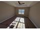 Bright bedroom featuring a tray ceiling, ceiling fan, and a large window offering natural light at Tbd 18 Privetts Rd., Conway, SC 29526