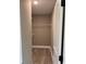 Walk-in closet with wooden-style floors and wire shelving for organization at Tbd16 Privetts Rd., Conway, SC 29526