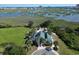 Aerial view of the clubhouse, pool, surrounded by tropical greenery and marsh at 1521 James Island Dr., North Myrtle Beach, SC 29582