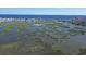 Aerial view of waterfront neighborhood featuring marshland, and coastal skyline at 1521 James Island Dr., North Myrtle Beach, SC 29582