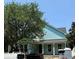 New home construction, featuring light blue vinyl siding, white trim, a covered porch with columns at 1521 James Island Dr., North Myrtle Beach, SC 29582