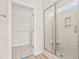 Modern bathroom features a glass enclosed shower with tile surround and built-in shelving at 623 Carter Reid Ct., Longs, SC 29568