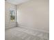 A bedroom with carpet floors and a single window to bring natural light into the space at 623 Carter Reid Ct., Longs, SC 29568