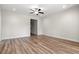 Bright, airy bedroom featuring wood-look floors, neutral paint, and a ceiling fan at 623 Carter Reid Ct., Longs, SC 29568