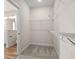Well-organized walk-in closet features carpet and shelving for ample storage space at 623 Carter Reid Ct., Longs, SC 29568