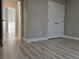 Bright bedroom with double doors and wood-look flooring at 2104 Ballast Ct., Myrtle Beach, SC 29579