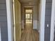 Open entryway with light yellow door and hardwood floors at 2104 Ballast Ct., Myrtle Beach, SC 29579