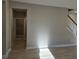 Light and airy hallway with staircase and neutral walls at 2104 Ballast Ct., Myrtle Beach, SC 29579