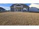 Gray house with back porch and grassy backyard at 2104 Ballast Ct., Myrtle Beach, SC 29579