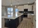 Modern kitchen with white cabinets and large island at 2104 Ballast Ct., Myrtle Beach, SC 29579