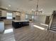 Open concept living area with hardwood floors and a large chandelier at 2104 Ballast Ct., Myrtle Beach, SC 29579