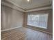 Simple spare bedroom with large window and hardwood floors at 2104 Ballast Ct., Myrtle Beach, SC 29579