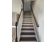 Wooden stairs with white risers and wooden railing at 2104 Ballast Ct., Myrtle Beach, SC 29579