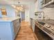 Well-equipped kitchen featuring stainless steel appliances, a center island, and modern cabinetry at 8560 Queensway Blvd. # 104, Myrtle Beach, SC 29572