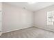 Well-lit bedroom with carpet and window at 1127 Cypress Shoal Dr., Conway, SC 29526