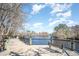 Serene riverwalk with wooden boardwalk, metal railings, and bench at 1127 Cypress Shoal Dr., Conway, SC 29526