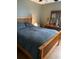 Cozy bedroom featuring a wood-framed bed and dresser, creating a warm and inviting atmosphere at 2276 Essex Dr. # A, Myrtle Beach, SC 29575