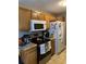 Well-equipped kitchen with wood cabinets and white appliances at 2276 Essex Dr. # A, Myrtle Beach, SC 29575