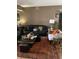 Open concept living room showcasing a large leather couch and coffee table at 2276 Essex Dr. # A, Myrtle Beach, SC 29575