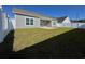 Charming backyard with green grass, white fence, and a covered patio at 1118 Cypress Shoal Dr., Conway, SC 29526