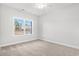 Well-lit bedroom with carpet and a large window at 4414 Kinlaw St., Little River, SC 29566