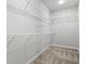 Large walk-in closet with wire shelving and hanging rods at 4414 Kinlaw St., Little River, SC 29566