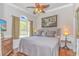 Comfortable bedroom with ceiling fan, large window and elegant decor at 5303 Pheasant Dr., North Myrtle Beach, SC 29582
