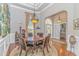 Elegant dining room featuring a round table, hardwood floors, and stylish decor at 5303 Pheasant Dr., North Myrtle Beach, SC 29582