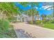 Inviting single-story home boasts a long driveway and lush landscaping at 5303 Pheasant Dr., North Myrtle Beach, SC 29582