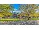 Charming home exterior with lush landscaping, fence, and welcoming entrance at 5303 Pheasant Dr., North Myrtle Beach, SC 29582