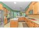 Spacious kitchen with light wood cabinets, granite countertops, and stainless steel appliances at 5303 Pheasant Dr., North Myrtle Beach, SC 29582