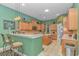 Well-lit kitchen boasts a breakfast bar, ample cabinetry, and stainless steel appliances at 5303 Pheasant Dr., North Myrtle Beach, SC 29582